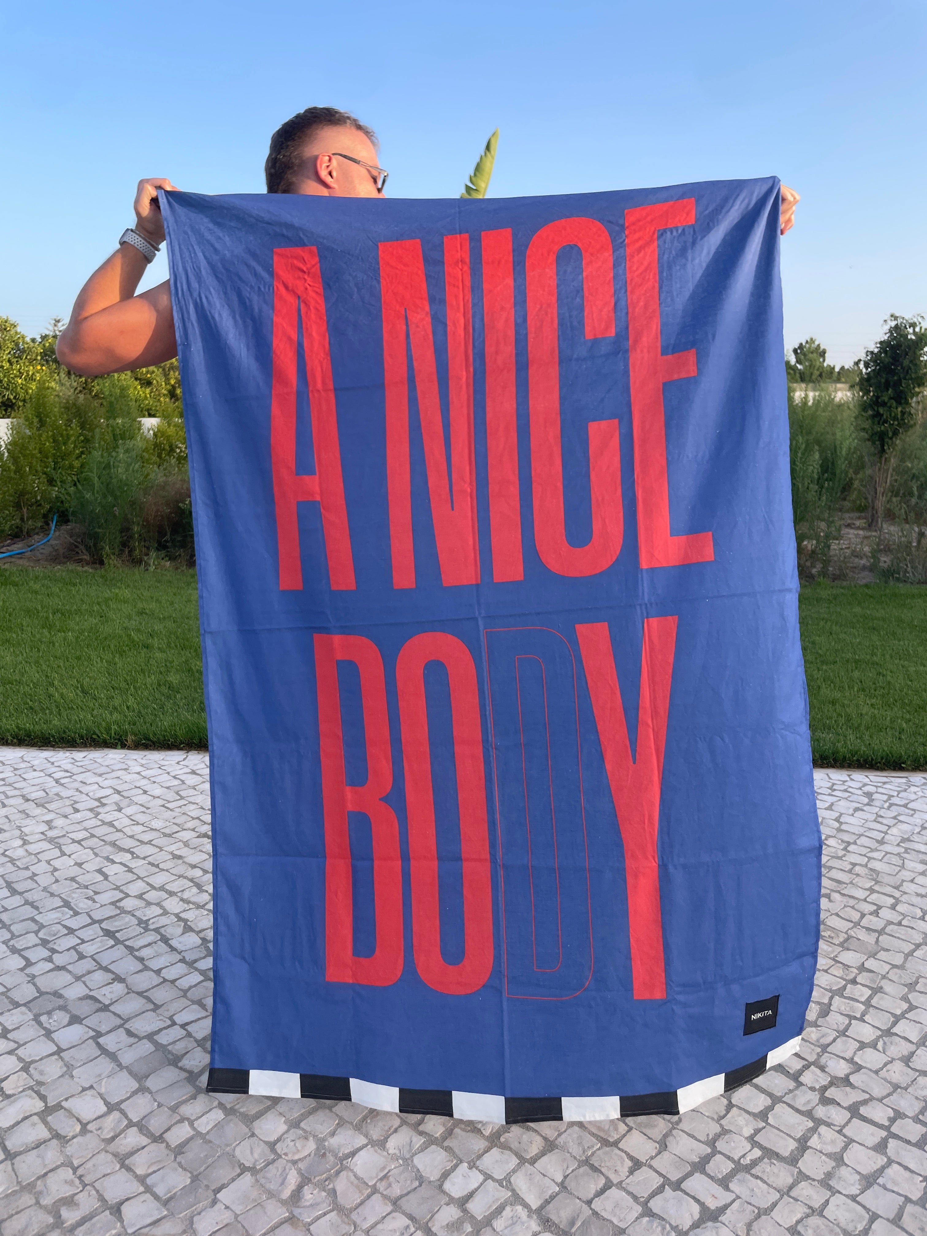 A NICE BODY BLUE BEACH TOWEL